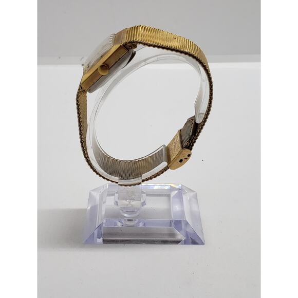 Women\'s Timex dress watch. Square iridescent face. Gold band. main image 9